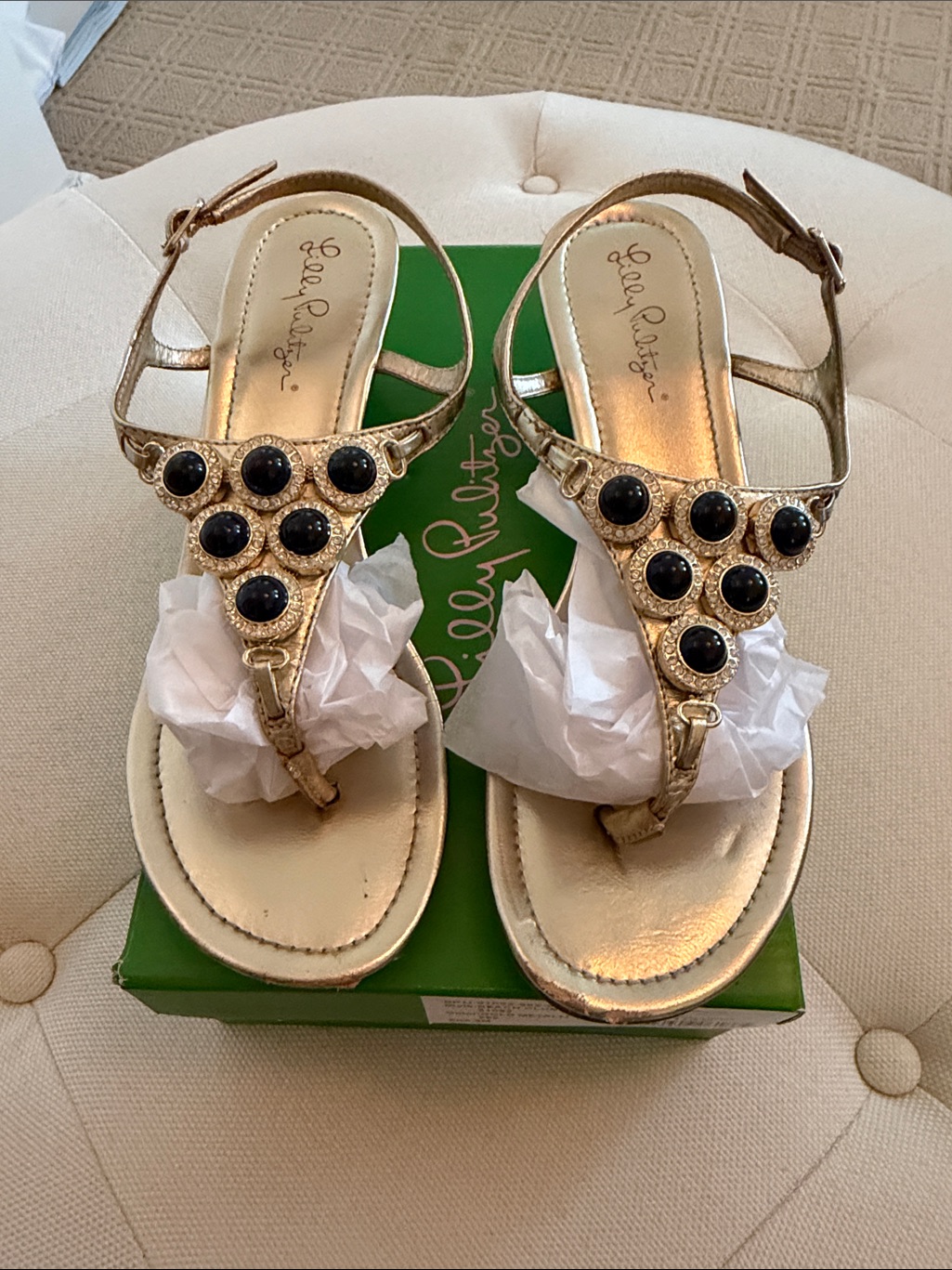 Lilly Pulitzer Metallic Gold T-Strap Sandals With Black Gem Accents.